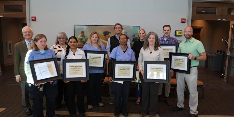 The 2023 Yellow jacket award winners holding their awards with president lindgren
