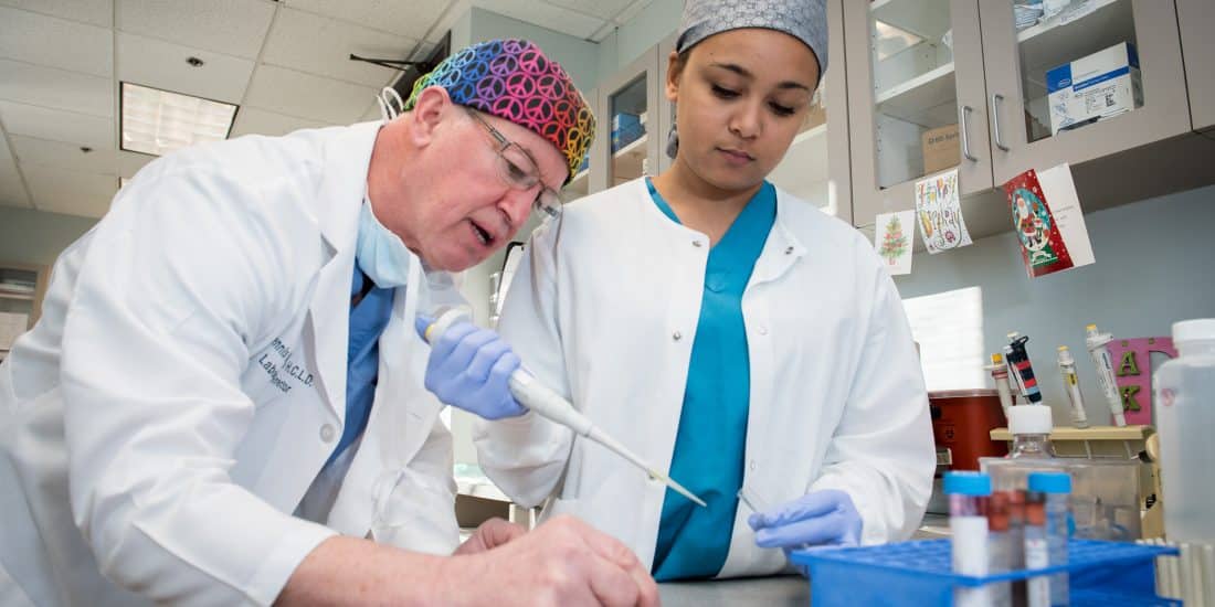 Randolph-Macon Lab instructor works with a student in a lab