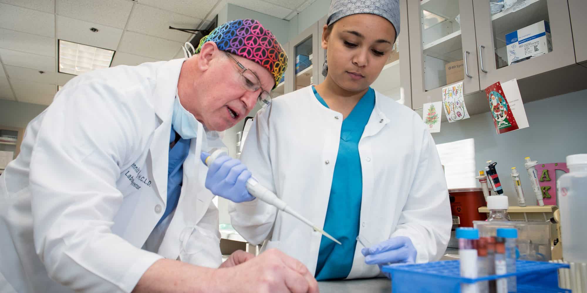 Randolph-Macon Lab instructor works with a student in a lab