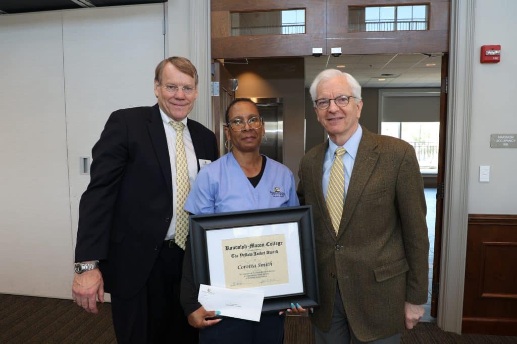 Coretta Smith with President Lindgren holding her Yellow Jacket Award