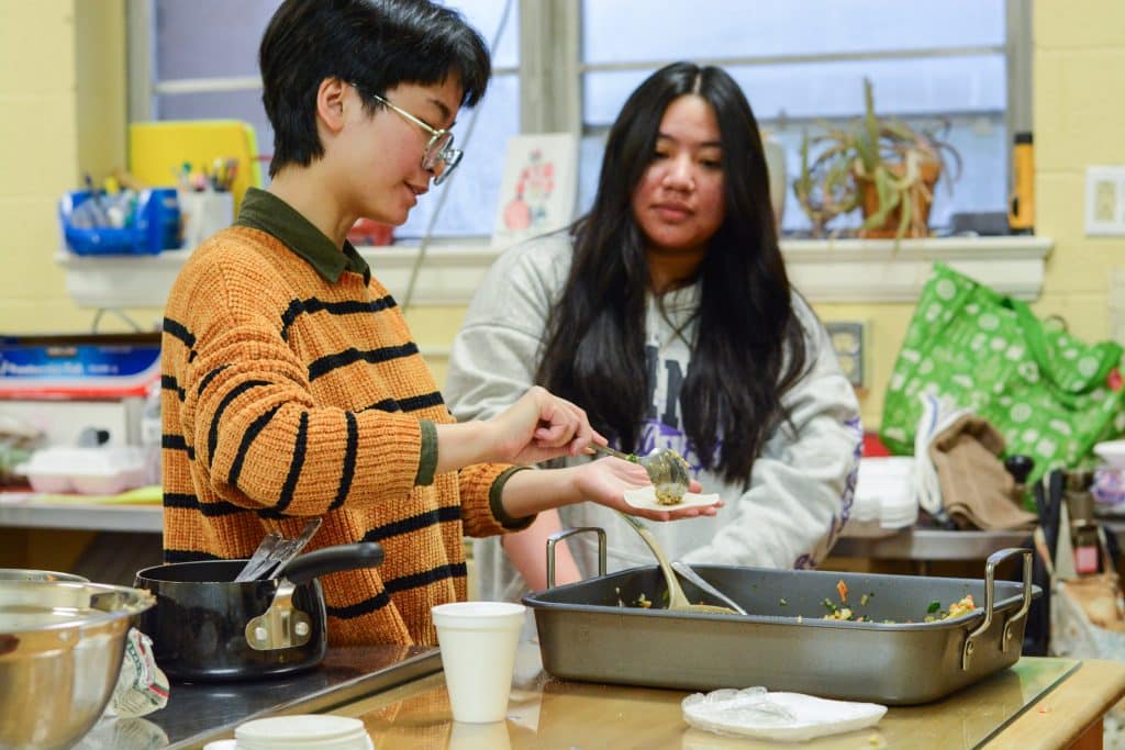 Students cooking dumplings in Prof. Cai's "Taste of China" class