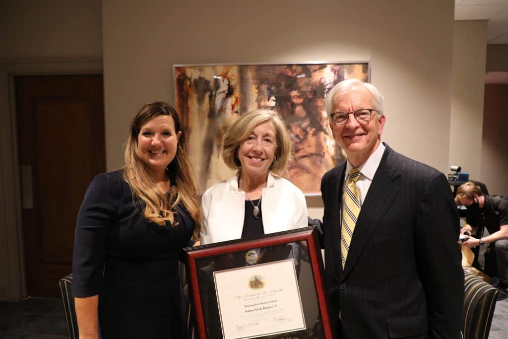 Donna Klepper, surrounded by President Lindgren and Robyn McDougle, as she holds her SOA award certificate