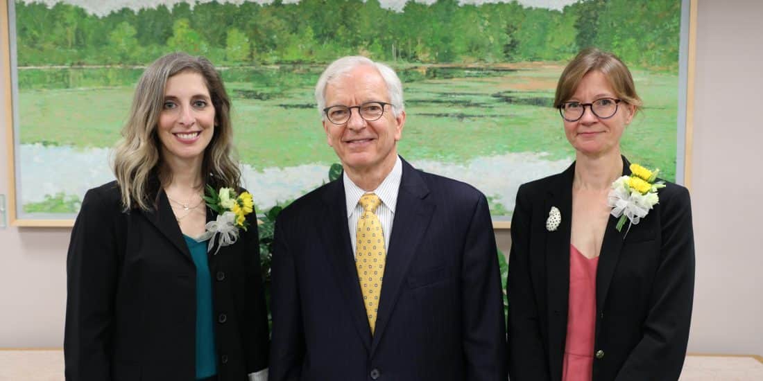 Professor Marisa R. Cull and Professor Jen Cadwallader standing with President Lindgren