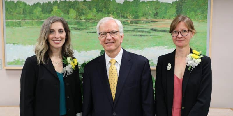 Professor Marisa R. Cull and Professor Jen Cadwallader standing with President Lindgren