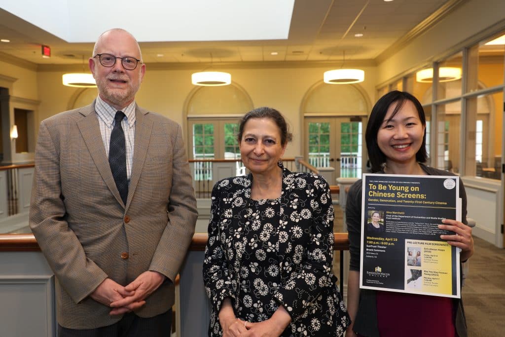 Dr Gina Michaels posing with an RMC Faculty Member and an RMC student