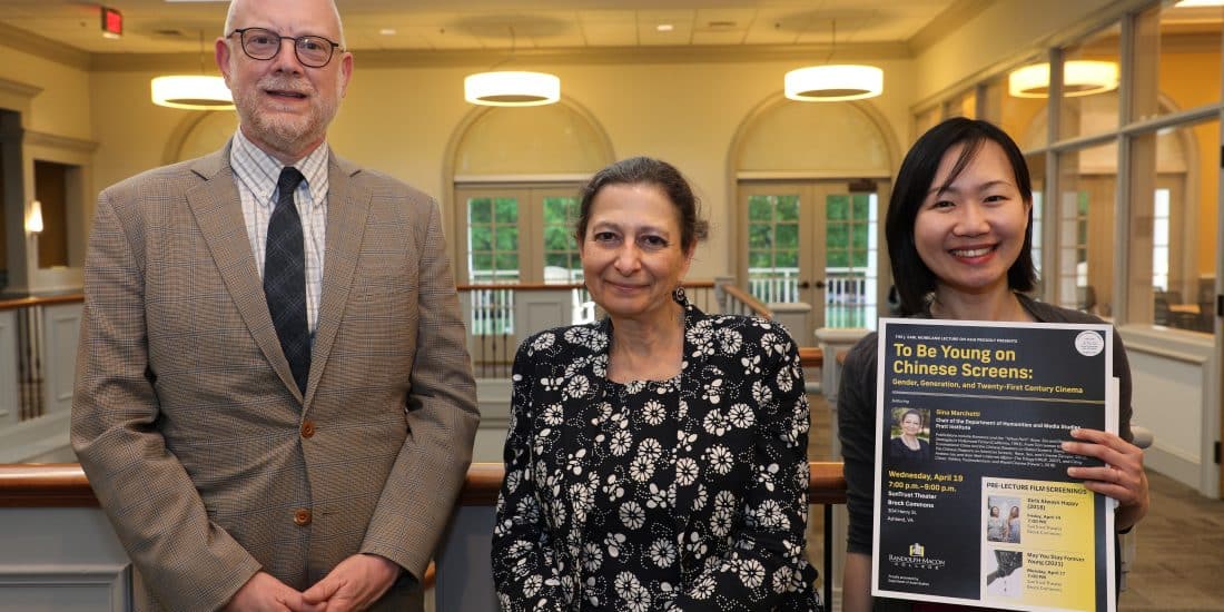 Dr Gina Michaels posing with an RMC Faculty Member and an RMC student