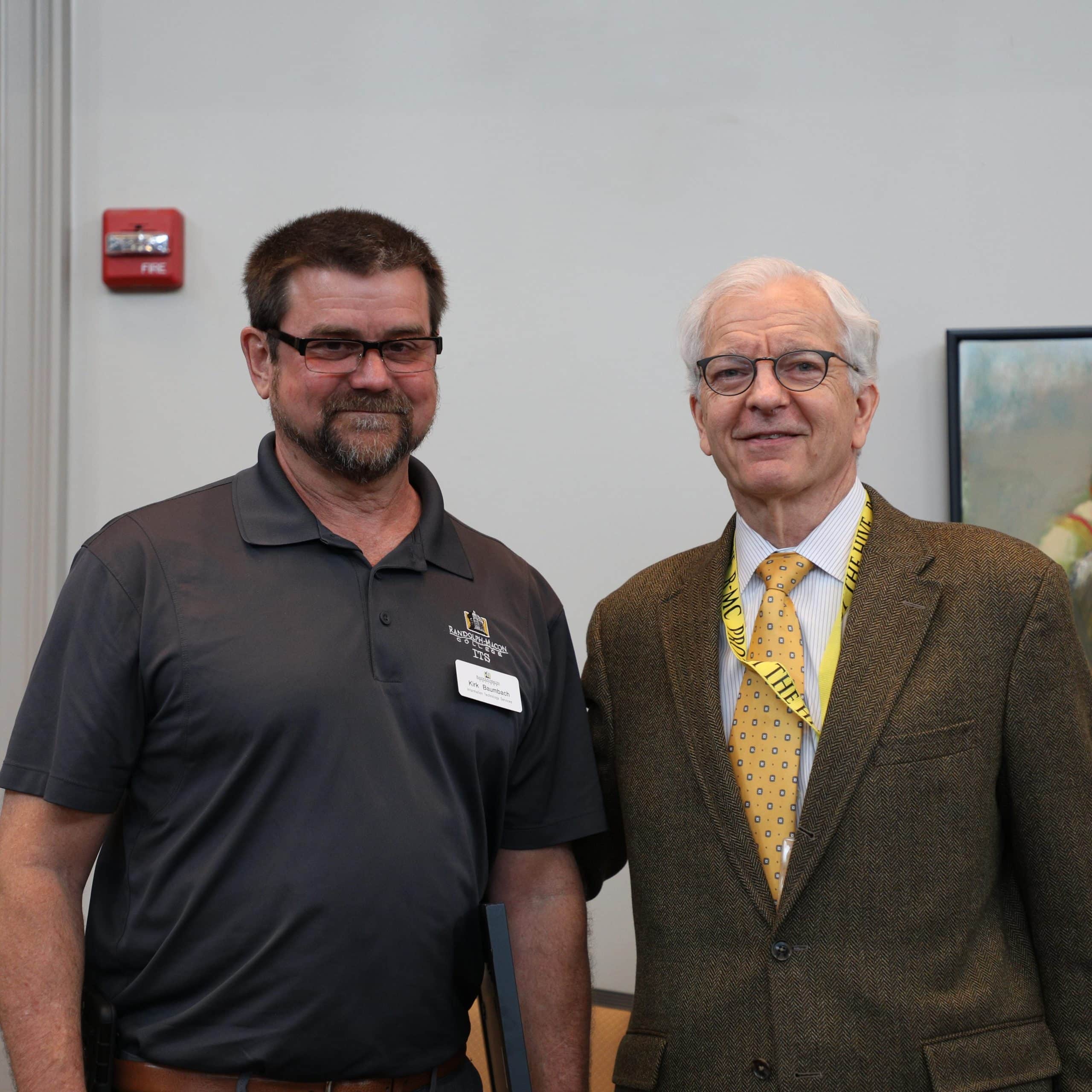 Kirk Baumbach posing with President Lindgren