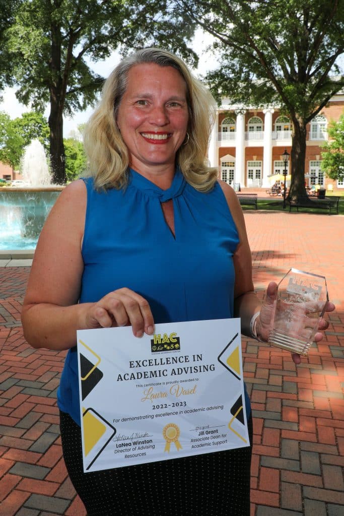 Laura Vasel poses with her Excellence in Academic Advising award