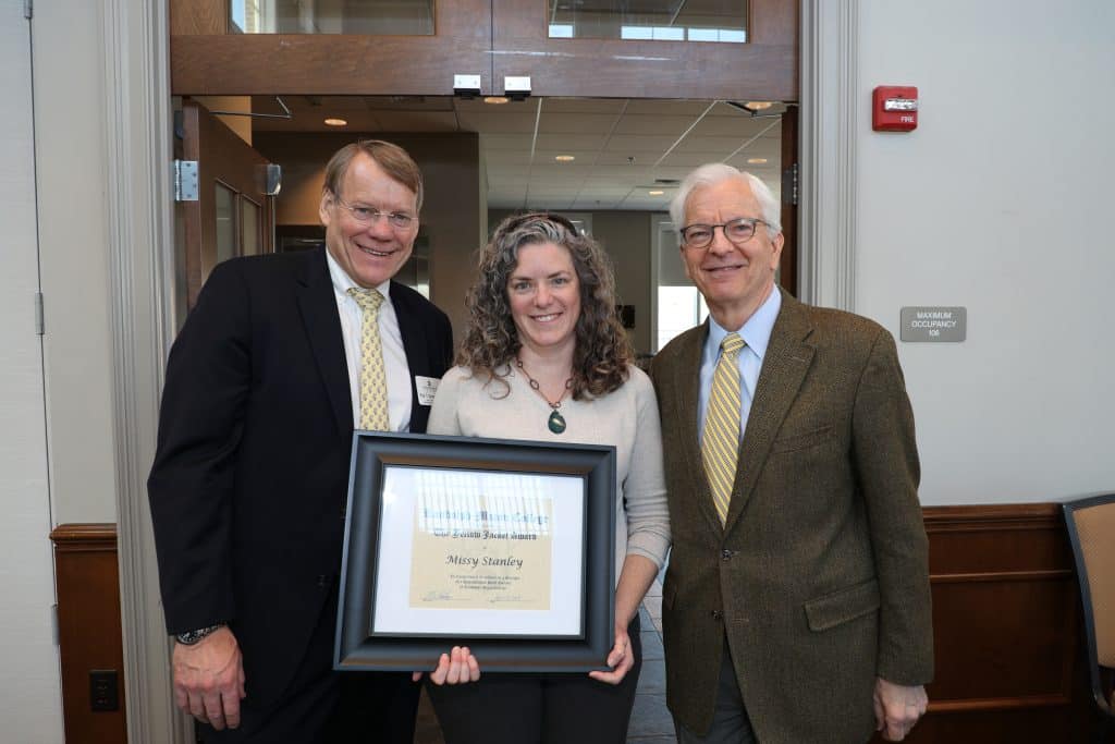 Missy Stanley with President Lindgren holding her Yellow Jacket Award