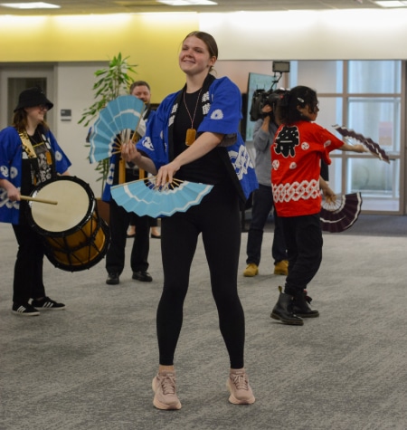 RMC's Japanese festival music team performs suzume odori at the dedication of the Taylor Bunko