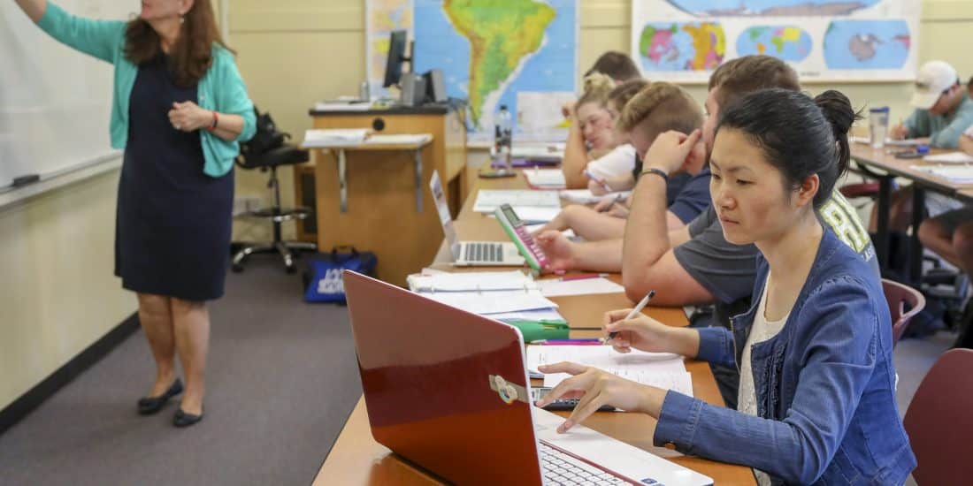 Accounting students with laptops in class