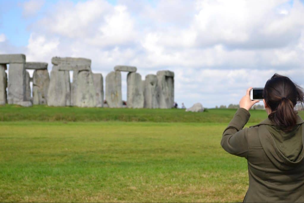 A psychology major taking a photo of Stonehenge