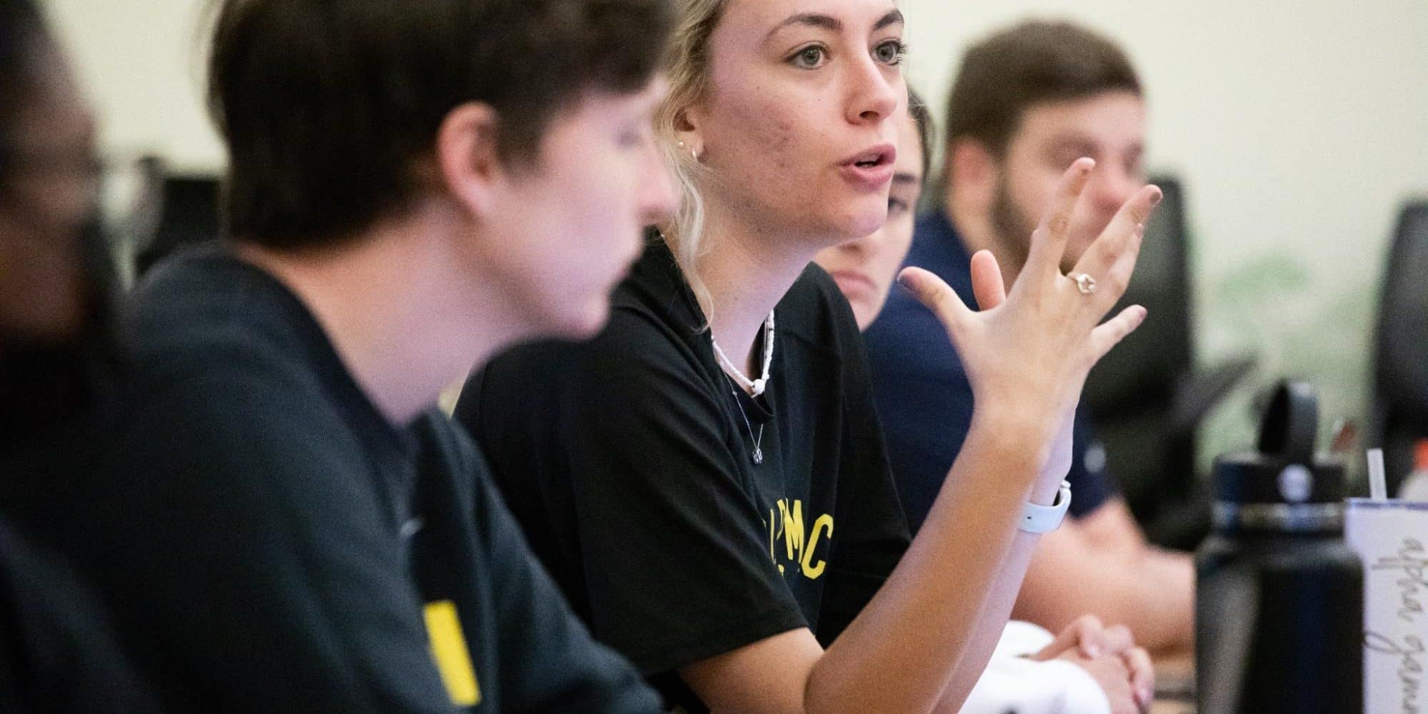 Student speaks during sociology class discussion