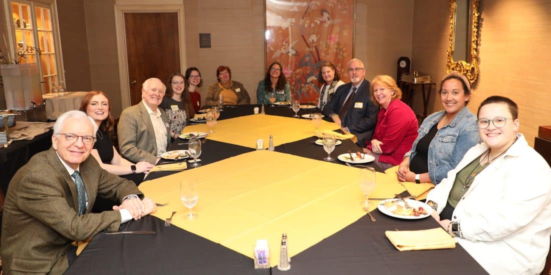 Randolph-Macon College President Lindgren sitting at a table with Pre-Min students.