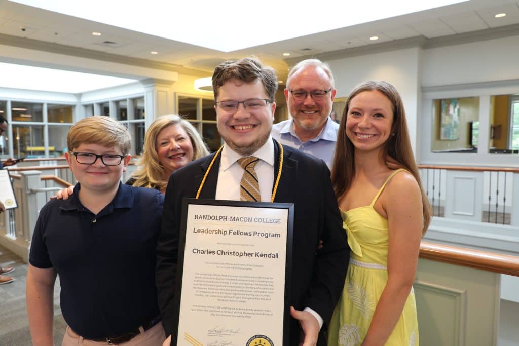 Randolph-Macon College student Charles Kendall receiving his Leadership Fellows graduation certificate.