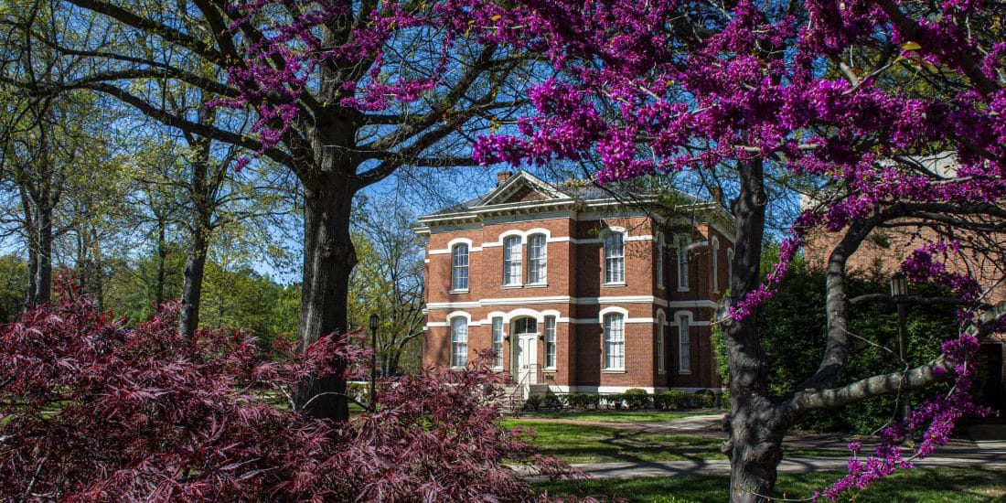 Randolph-Macon College Wash Frank building framed by blooming trees