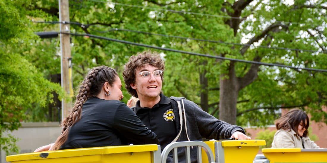 Randolph-Macon College students riding a carnival ride during the annual Camptown event.