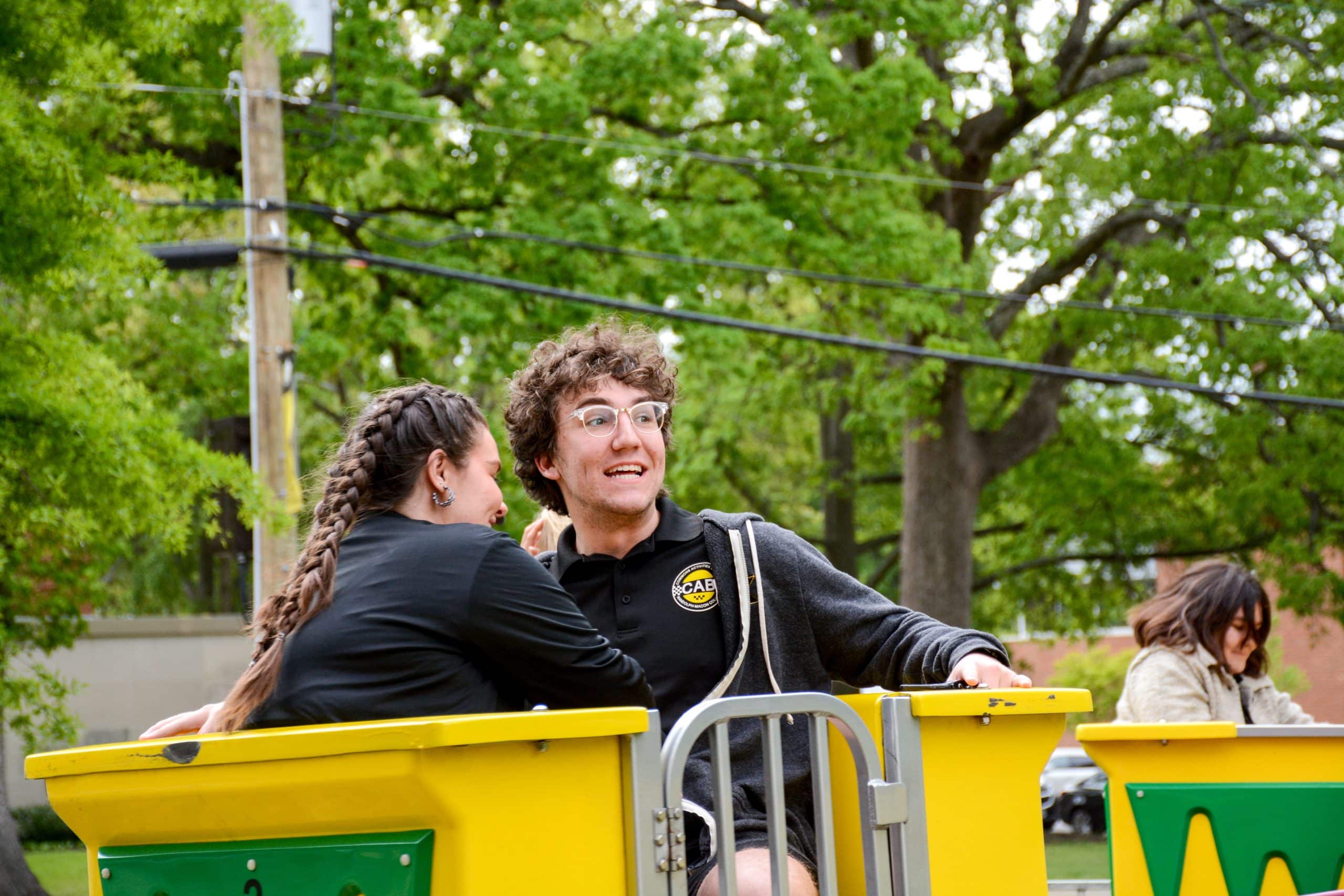 Randolph-Macon College students riding a carnival ride during the annual Camptown event.