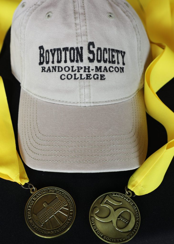 Two medals and a hat from the Boydton Society.