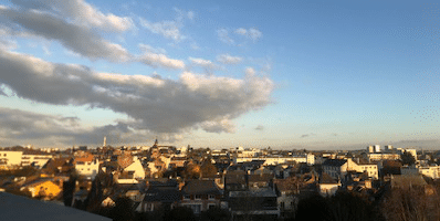 A scholarship-funded opportunity to explore the world offers a breathtaking view of a city from the top of a building.