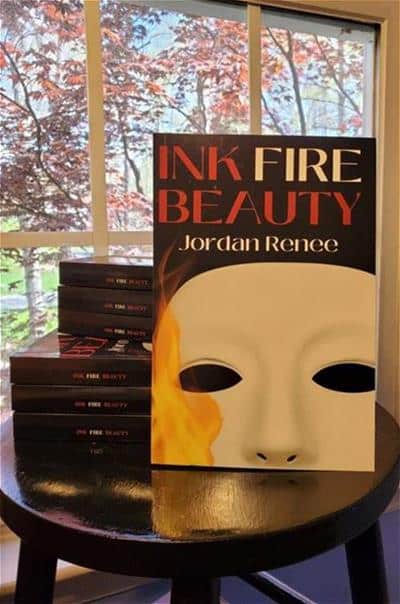 A stack of books titled Ink fire beauty by jordan Renee