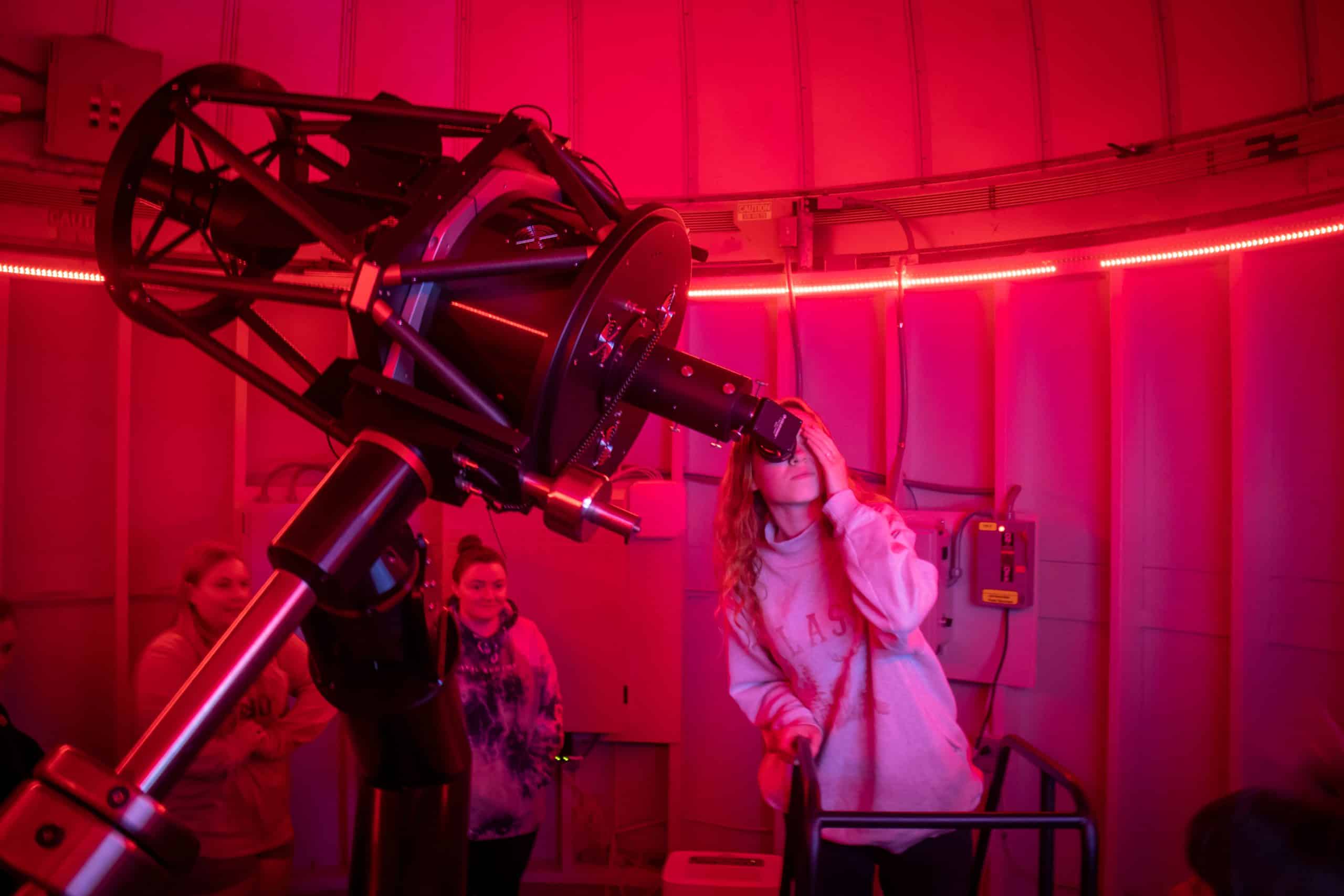 Students looking out of the Keeble observatory telescope