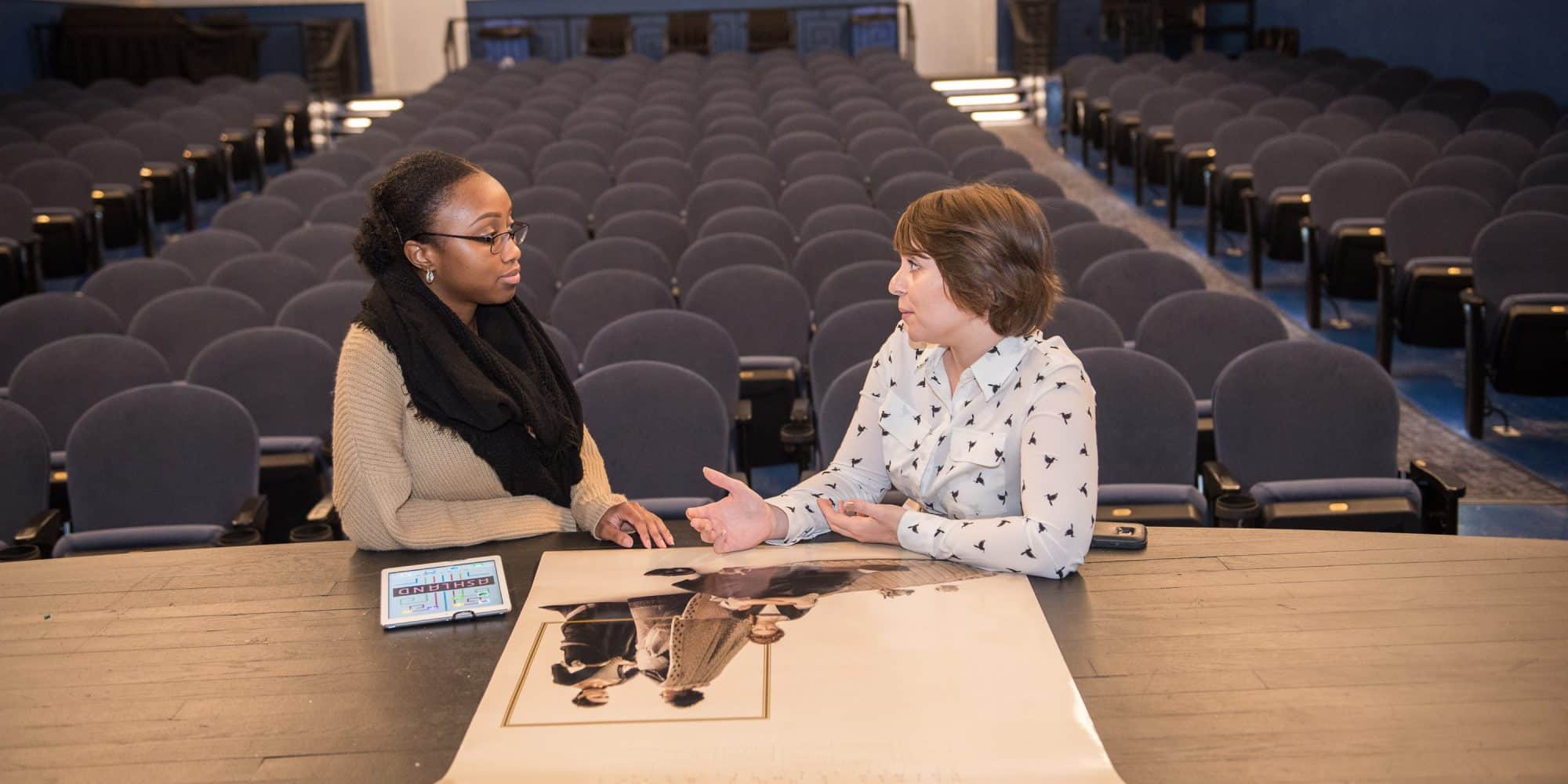 A RMC student and employee work together at the Ashland Theater during an internship