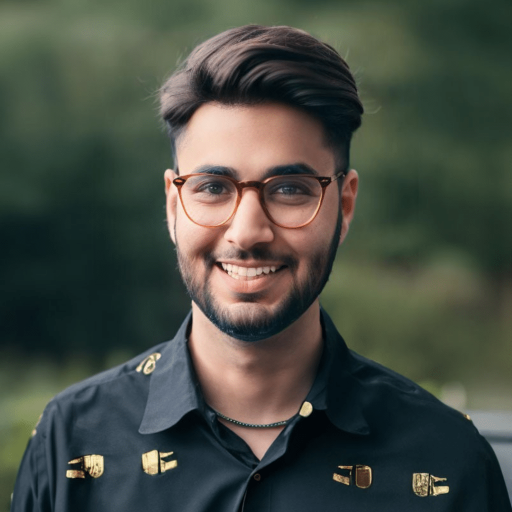 A creative man wearing glasses and a black shirt.