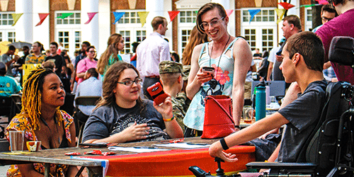 A diverse and inclusive group of people at a table.