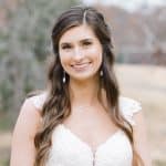 A bride smiles for the camera.