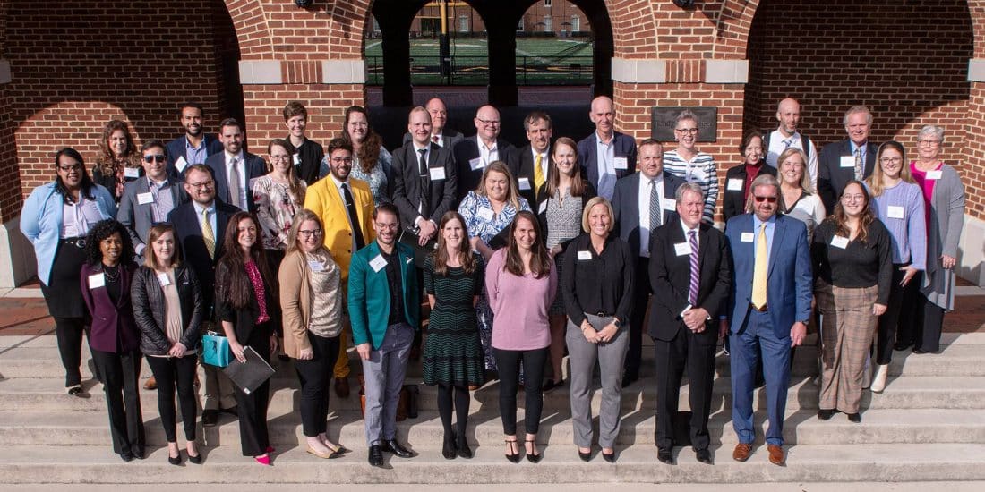 Volunteers at the Fall 2023 Edge Boot Camp pose in front of Birdsong