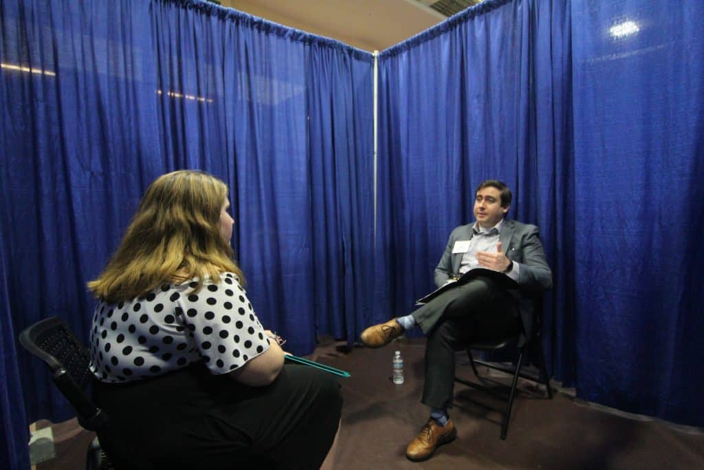 Robert Thomas '11 conducts a mock interview with a student at the Edge Boot Camp