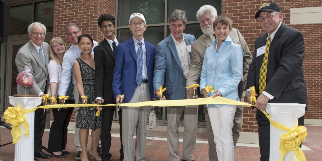 RMC faculty with president lindgren cutting the ribbon at the brock hall dedication