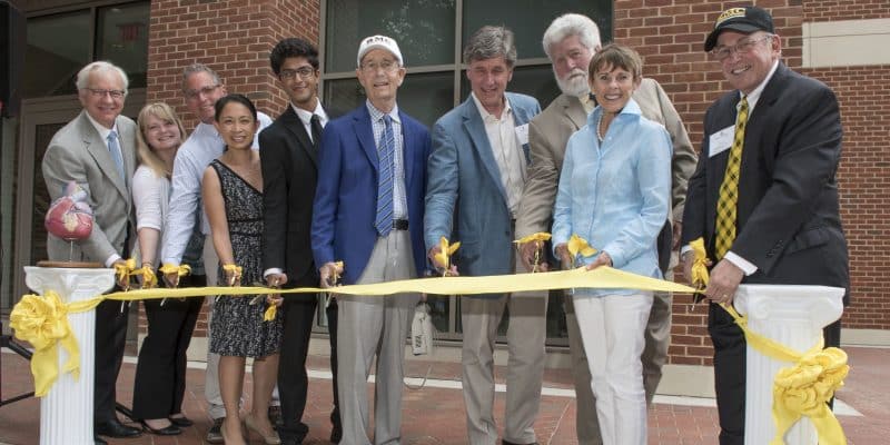 RMC faculty with president lindgren cutting the ribbon at the brock hall dedication