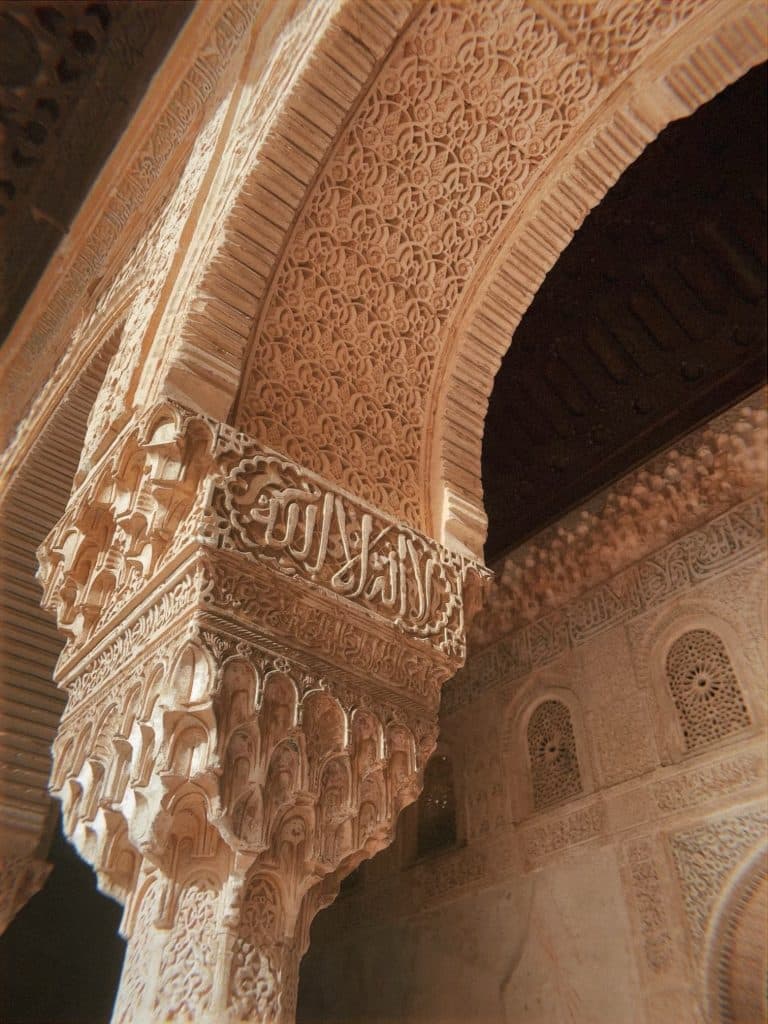 An ornately carved archway in a building in Granada, Spain.