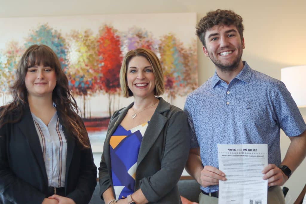 RMC students Rose Lumpkin and Ren Hinchey pose for a photo with Delegate Coyner during a visit to the VA General Assembly