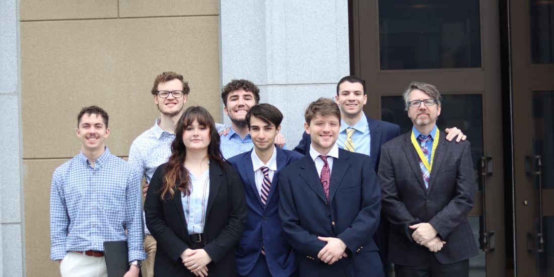 Student and Professor Rich Meagher pose outside of the VA General Assembly Building during a J-Term visit for the course Virginia Politics in Action.