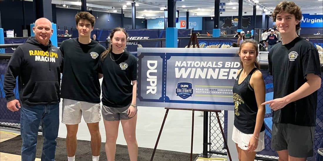 Members of Randolph-Macon's club pickleball team pose with Director of Physical Education, Recreation and Wellness Bill Blackmore in front of pickleball courts
