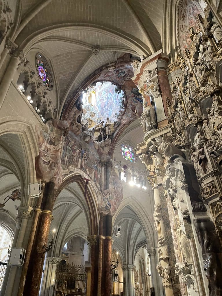 The inside of a cathedral with ornate carvings and statues.