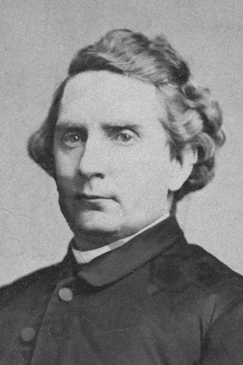Monochrome portrait of a 19th-century gentleman with wavy hair, notable in university administration.