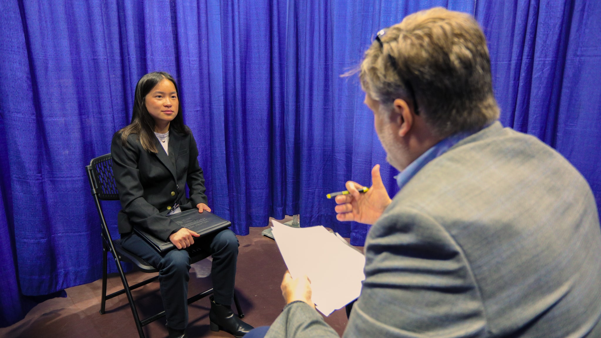 A student and a volunteer participate in a mock interview during the Edge Boot Camp