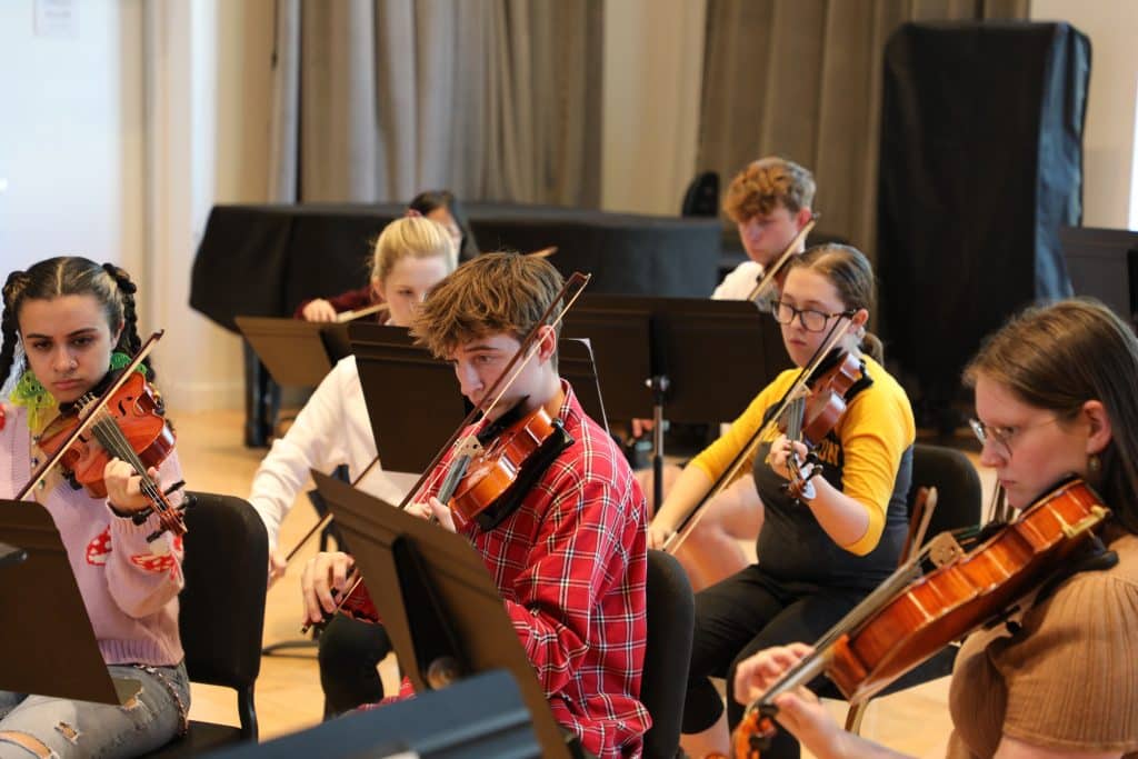 The Symphony Orchestra rehearsed in the Haun Rehearsal Hall for their upcoming performance.