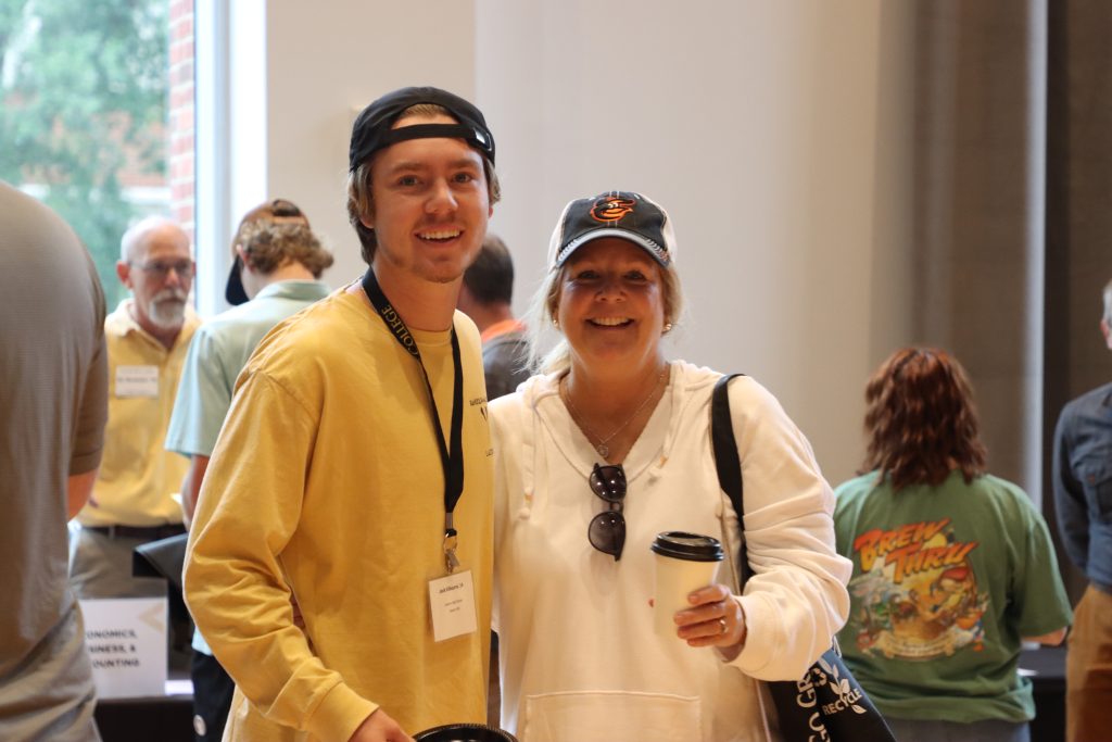 Prospective student and parent at RMC admissions event.