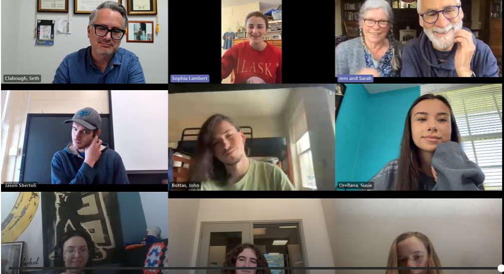 A group of eleven individuals participate in a video call, each shown in separate panels with varied backgrounds.