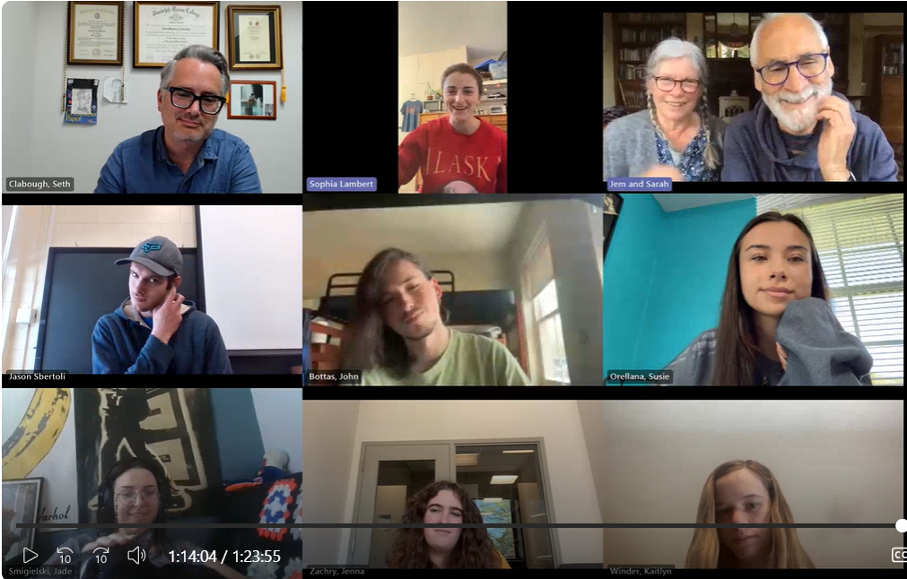 A group of eleven individuals participate in a video call, each shown in separate panels with varied backgrounds.