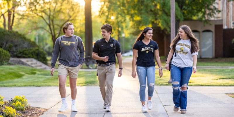 Students walk together on RMC path.
