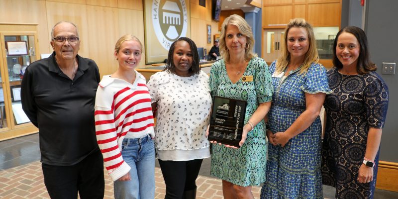 Associate Professor Nthemba Mutua-Mambo, Sydney Robertson, a Hanover County resident, and Hanover officials pose together holding the VACo Achievement Award.