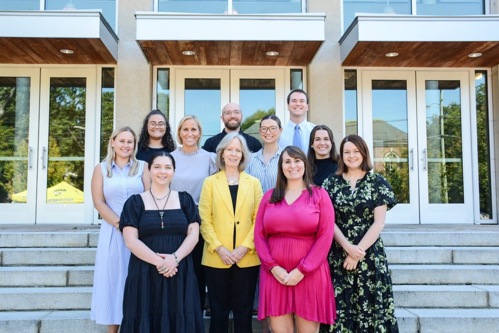 The RMC admissions team poses for a group photo in front of the Center for the Performing Arts.