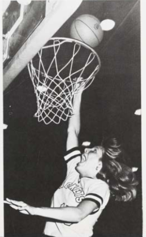 A black-and-white photo of Cindy Crabill Szadokierski making a lay-up