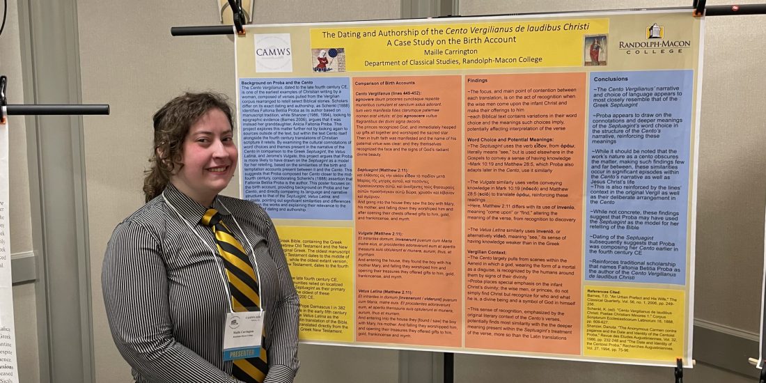 An RMC student in business dress stands in front of a research poster about the dating and authorship of Proba's Cento